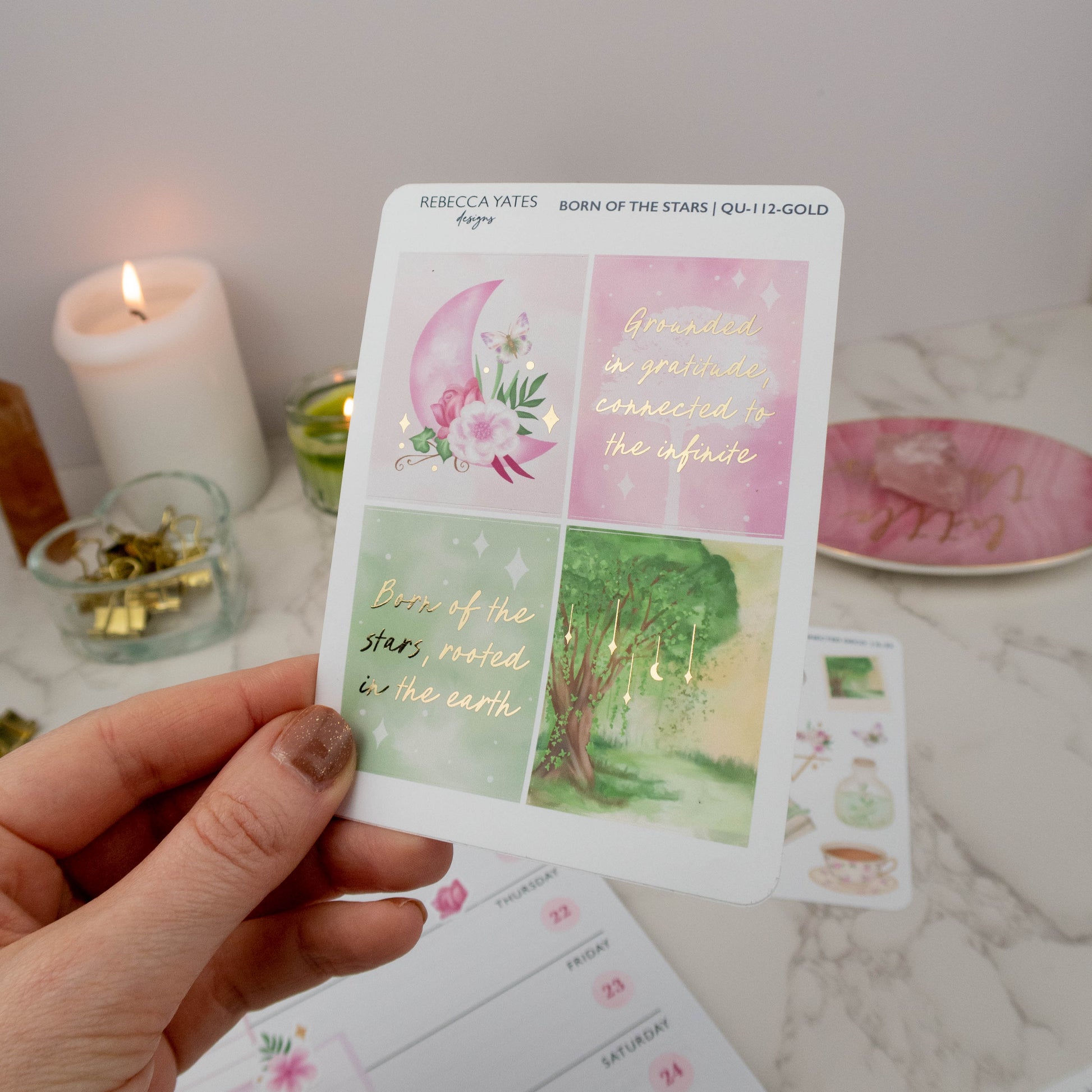 Gold-foiled sticker sheet featuring celestial and nature-themed designs, including quotes and illustrations, perfect for planners and journals